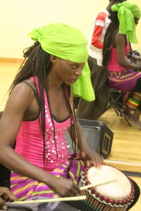 Nogaye plays drums at the sabar dance class.