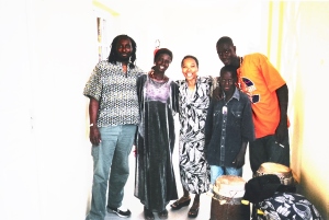 Dance teacher and drummers Moustapha Faye and Malick Ngom (front) with  Sipho Bellinger and Nailah Randall Bellinger, after class. 