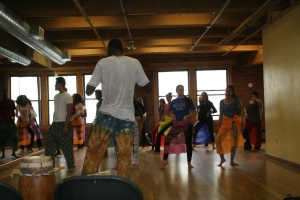 Moustapha Faye teaching dance to students at Suffolk University.